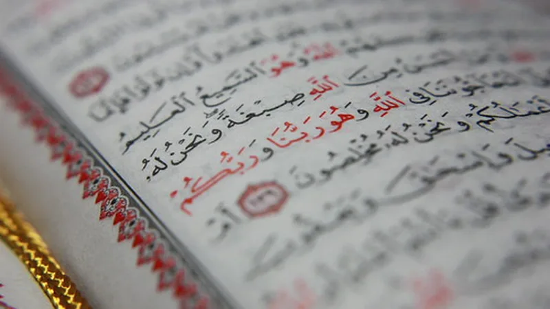 Quran pages in soft light - choosing a male or female Quran teacher for your child